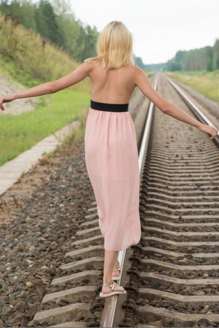 Ronda posing on A railroad