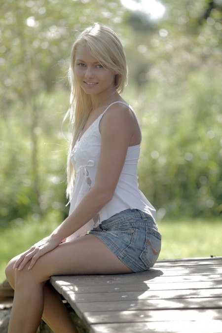 Annely Gerristen In a white blouse and denim skirt