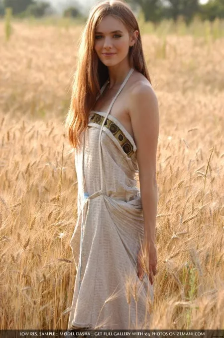 Walks naked through a field of wheat