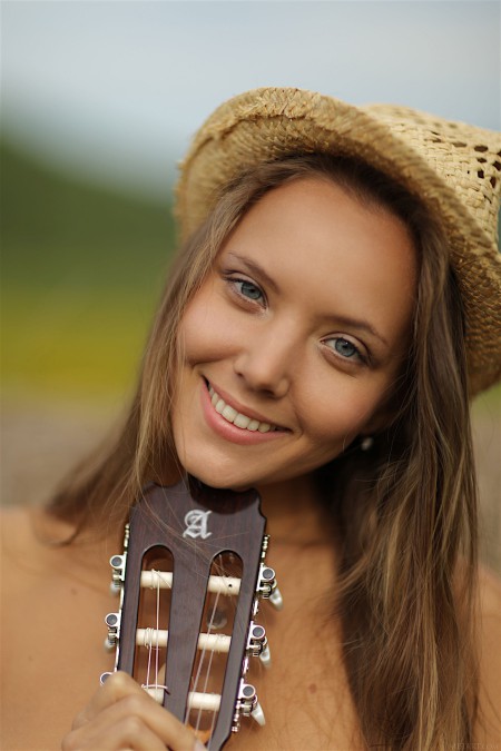 With a guitar