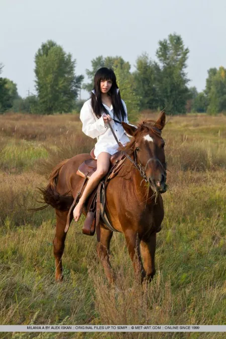 Milania near A horse
