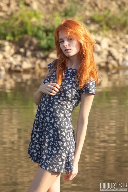 The redhead on the banks of the river